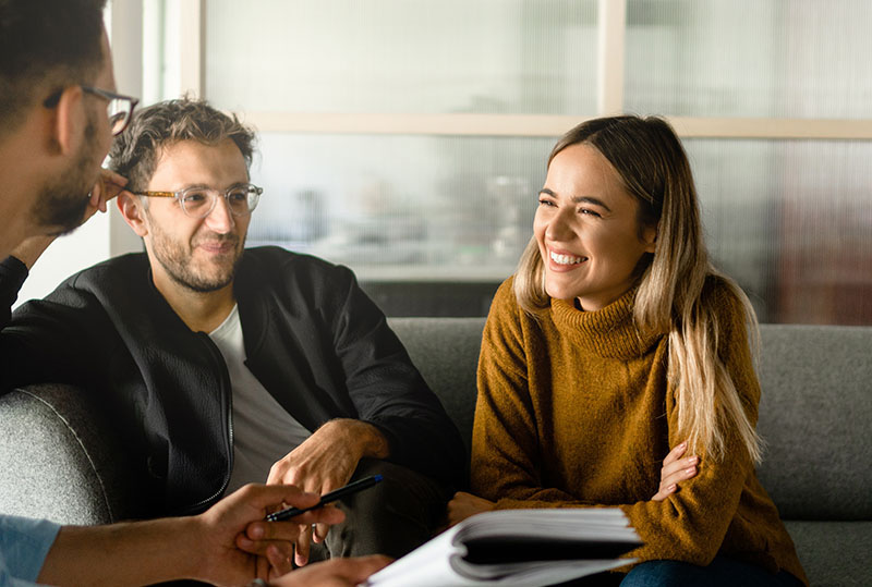 man and woman talking to man